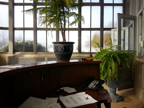 Reading, maybe, "A History of Belle Isle" at the front desk.
