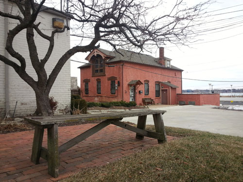 This inviting bench has a nice view of the adjacent carriage house, totally mismatched in style from the house it sits behind.